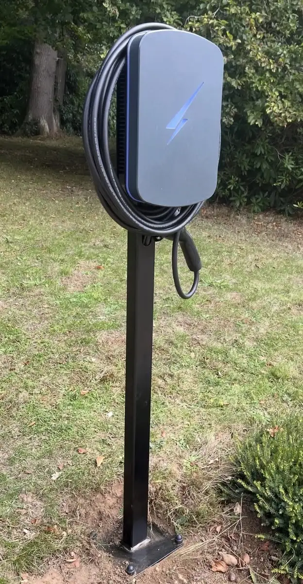 Home EV charger installed on an exterior wall