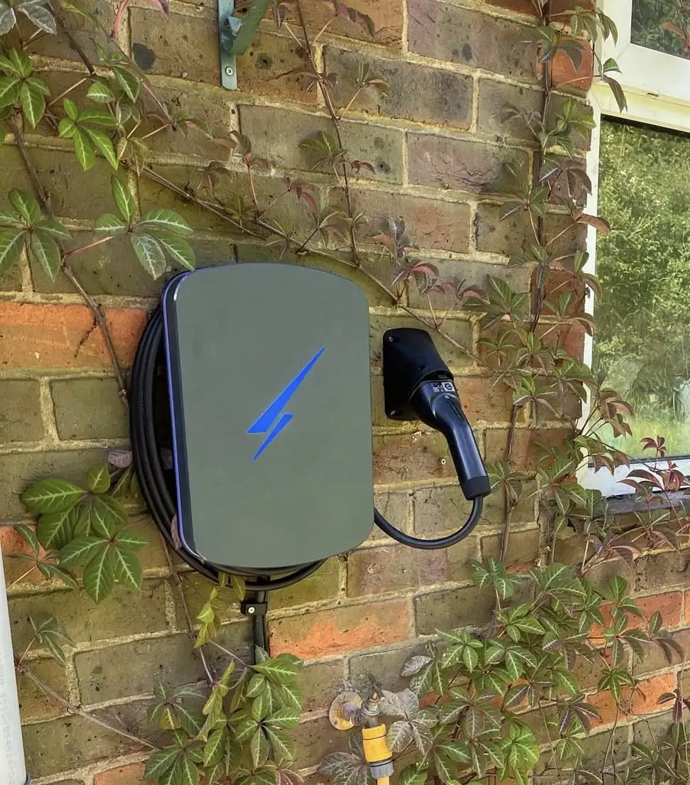 Home EV charger installed on an exterior wall
