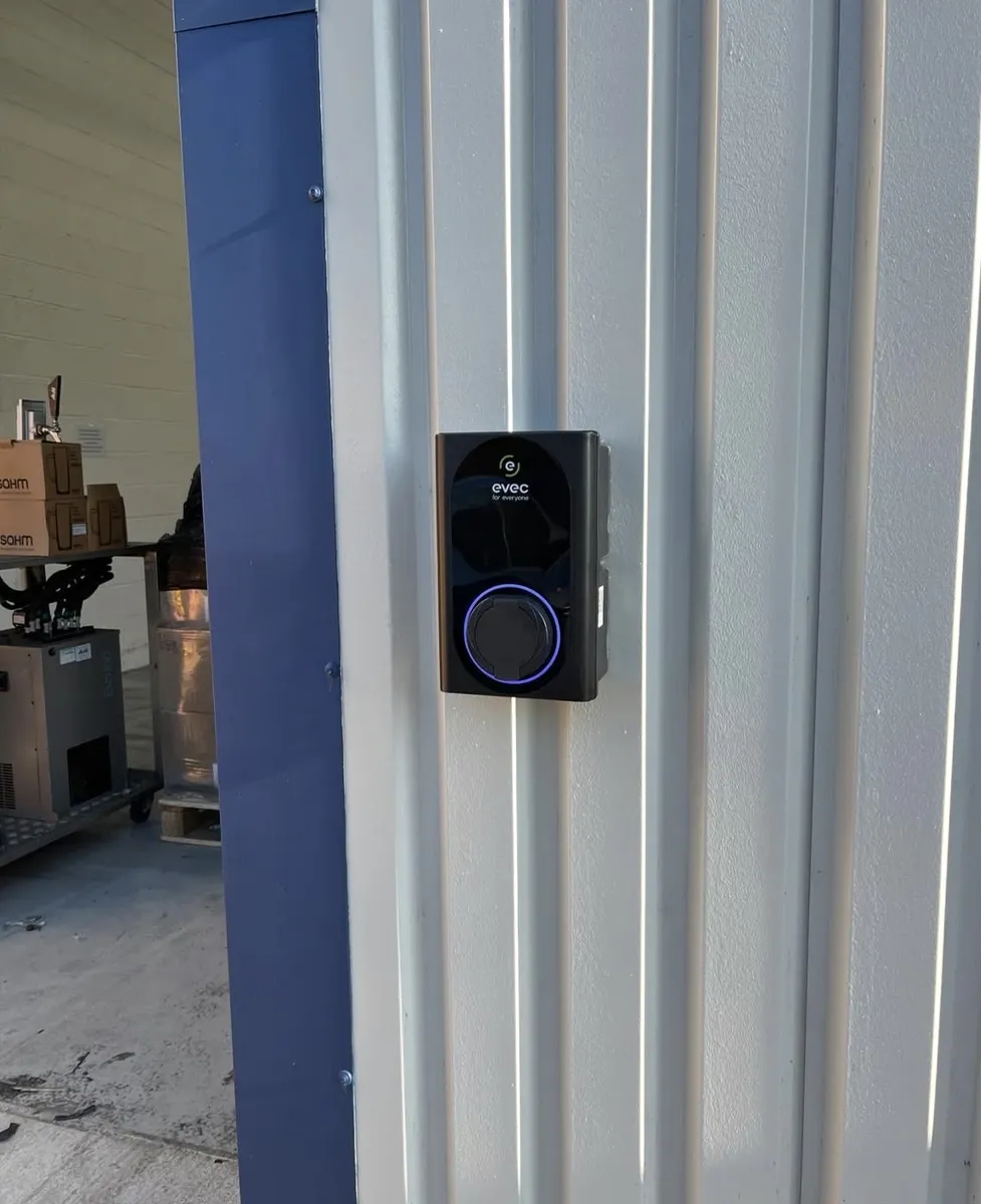 Home EV charger installed on an exterior wall